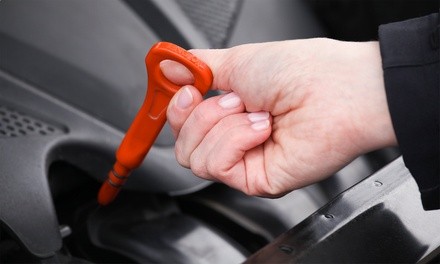 Oil Change or Brake Pad Replacement at Express Quick Lube (Up to 51% Off). Three Options Available.