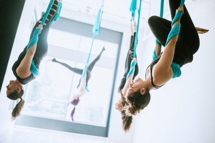Innovative yoga and fitness classes that combine acrobatics, strength training, and flexibility work