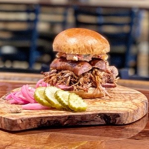 Barbecue and More for Takeout and Dine-In at K-Block’s Fire Pit BBQ (Up to 31% Off)