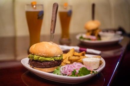 Burgers, Steaks, and Ribs for Lunch or Dinner at Wolfs Head Restaurant & Bar (Up to 51% Off)