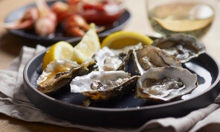 Oysters and Beer flight for Two, Three, or Four at Shucking Awesome Oyster & Raw Bar (Up to 23% Off)
