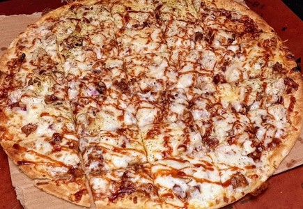 Pizza for Takeout and Dine-In at Minnies Pizza & Paint Shop (Up to 33% Off). Three Options Available.